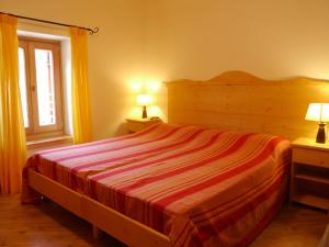 Ένα ή περισσότερα κρεβάτια σε δωμάτιο στο Garnì Sella Cipriani