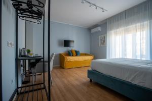 Postel nebo postele na pokoji v ubytování Alma Sorrento Suite