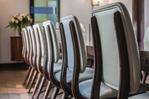 a row of chairs lined up in a row at The Norman Tel Aviv in Tel Aviv