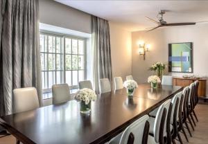 a dining room with a table and chairs at The Norman Tel Aviv in Tel Aviv