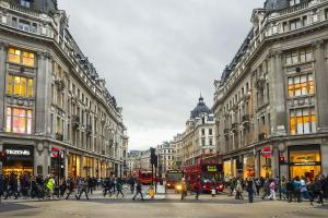 a busy city street with people crossing the street at Sootheus - Soho7 in London