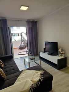 TV a/nebo společenská místnost v ubytování Lovely Apartment Funchal