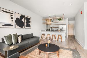 a living room with a couch and a table at The Eighteen by Locale in Nashville