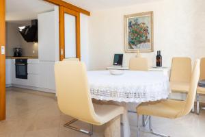 a kitchen and dining room with a table and chairs at Apartment Kekia in Dubrovnik