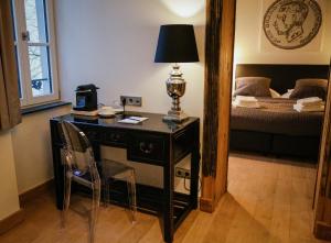 Rúm í herbergi á La Pipistrelle Hotel