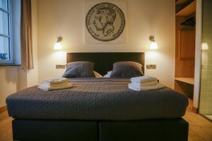 Rúm í herbergi á La Pipistrelle Hotel