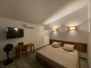 Ein Bett oder Betten in einem Zimmer der Unterkunft Bahía Santamaría