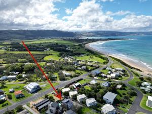 an aerial view of a beach with houses and the ocean at Seaside Pleasure in Apollo Bay