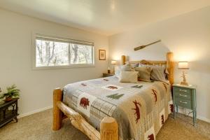 Schlafzimmer mit einem Bett und einem Fenster in der Unterkunft 30-Acre Witter Springs Ranch with Barn and Views! in Upper Lake