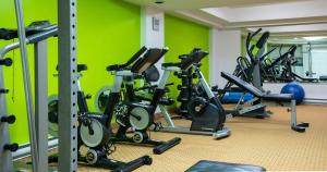 a gym with a bunch of exercise bikes in a room at Empire Suites in Montreal
