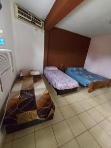 Katil atau katil-katil dalam bilik di Hotel Los Chow Chow