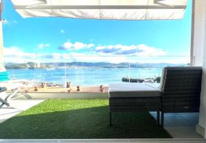 a room with a large window with a view of the ocean at Apartment Covelo in Samieira