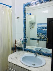 a bathroom with a sink and a mirror and a tub at LA VISTA Ain Elsokhna 1&2 Chalet in Ain Sokhna