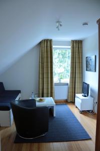 Ein Sitzbereich in der Unterkunft Hotel Schlafschön