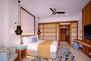 Postel nebo postele na pokoji v ubytování laïla, Seychelles, a Tribute Portfolio Resort + 37 fotografií