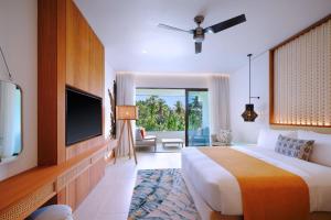Postel nebo postele na pokoji v ubytování laïla, Seychelles, a Tribute Portfolio Resort