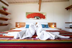 Voodi või voodid majutusasutuse Enchanted Galapagos Lodge toas