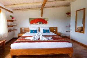 Voodi või voodid majutusasutuse Enchanted Galapagos Lodge toas