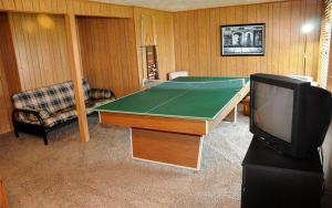 a living room with a pool table and a tv at Seven Springs Swiss Mountain 3 Bedroom Standard Condo, Sleeps 8! condo in Champion