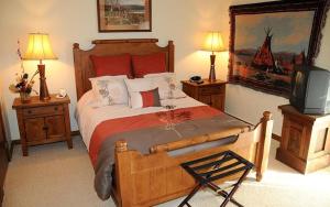 a bedroom with a bed and a tv in it at Seven Springs 2 Bedroom Standard Condo, Sleeps 10! condo in Champion
