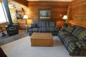 a living room with two couches and a stove at Seven Springs Swiss Mountain 3 Bedroom Standard Condo, Close to Golf Course condo in Champion