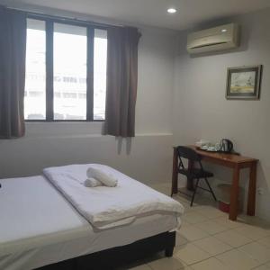 Postel nebo postele na pokoji v ubytování Reintree Lodge Hotel