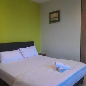 Postel nebo postele na pokoji v ubytování Reintree Lodge Hotel