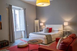 Postel nebo postele na pokoji v ubytování Palazzo Gilistro
