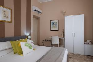 Postel nebo postele na pokoji v ubytování Palazzo Gilistro