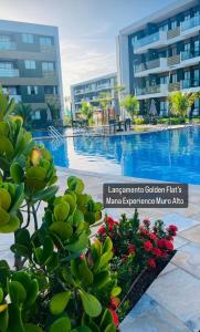 Blick auf einen Swimmingpool in einem Hotel in der Unterkunft Mana & Makia Slin Muro Alto in Porto De Galinhas