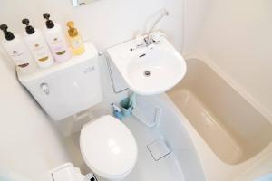 a bathroom with a sink and a toilet and a bath tub at 難波南52 in Osaka +41 photos