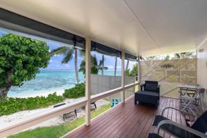 a porch with a view of the ocean at Ann's Island Beach Studio in Rarotonga
