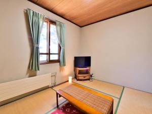 TV a/nebo společenská místnost v ubytování Kurumayama Kogen Guesthouse Urara
