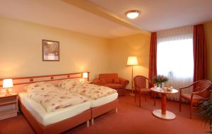 Postel nebo postele na pokoji v ubytování Hotel Atlantis