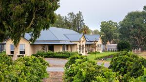 a house with a garden in front of it at Triple Creek Guest House - Barossa Region in Seppeltsfield