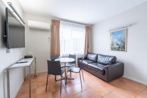 TV a/nebo společenská místnost v ubytování Forrest Hotel & Apartments