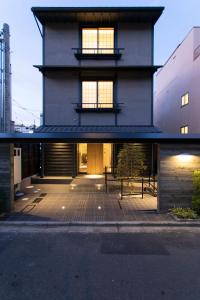 a large house with a courtyard in front of it at Higashiyama Hills in Kyoto