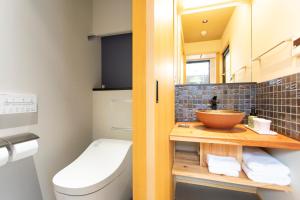 a small bathroom with a sink and a toilet at Higashiyama Hills in Kyoto