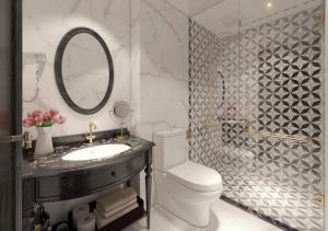 a bathroom with a sink and a toilet and a mirror at Le Grand Hanoi Hotel - 18 Hàng Quạt by Bay Luxury in Hanoi