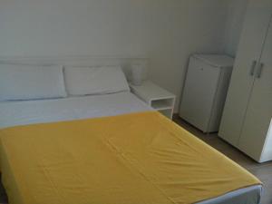 A bed or beds in a room at Hostal Cubelles