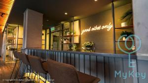 a row of chairs sitting in front of a restaurant at Ceylonz Suites by MyKey in Kuala Lumpur
