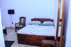Postel nebo postele na pokoji v ubytování King's Hill Hotel
