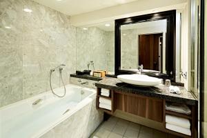 a bathroom with a sink and a bath tub and a sink at InterContinental Tokyo Bay by IHG in Tokyo