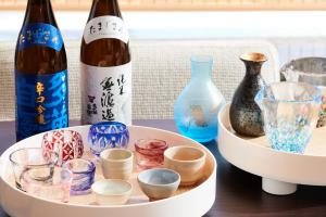 a table with two bottles of wine and glasses at InterContinental Tokyo Bay by IHG in Tokyo