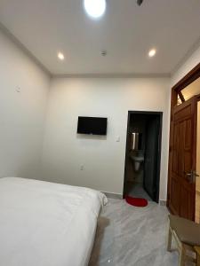 Giường trong phòng chung tại LES AMIS HOTEL ĐÀ LẠT