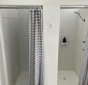a shower with a shower curtain in a bathroom at Royal Hotel - Accommodation only in Parkes +18 photos