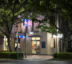 a store front of a building at night at Royal Hotel - Accommodation only in Parkes