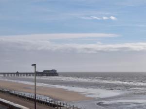 a view of a beach with a pier and the ocean at Clifton House B - Uk42844 in Lytham St Annes