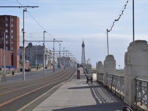 a bridge over a street with a bench on it at Clifton House B - Uk42844 in Lytham St Annes