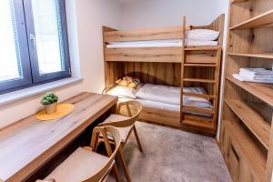 Rúm í herbergi á Bungalovy BLUDOVEČEK